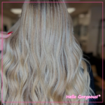 A close-up shot of blonde, wavy hair with different shades of blonde throughout.